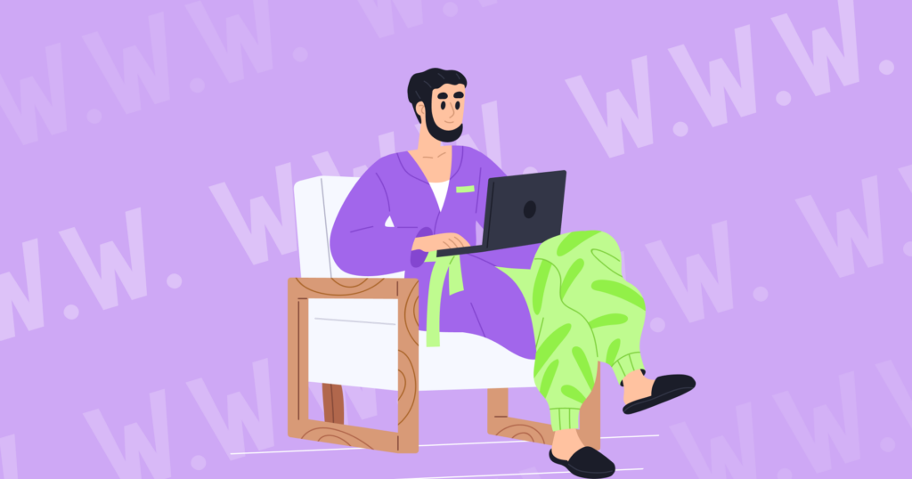 Showing a man in a home suit sitting in a chair with a laptop.