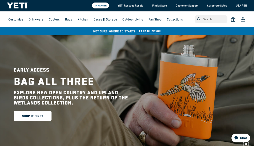 YETI website main page with the banner text “Bag all three” and a photo of a person holding a flask with a bird design
