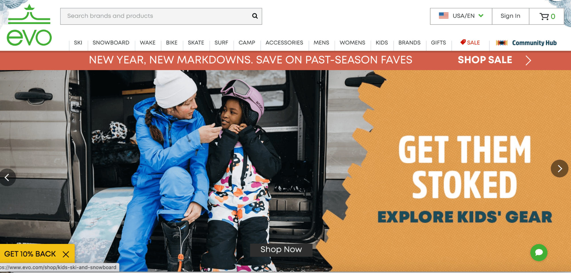 The image displays the homepage of EVO with an image of two kids getting ready for snowboarding.
