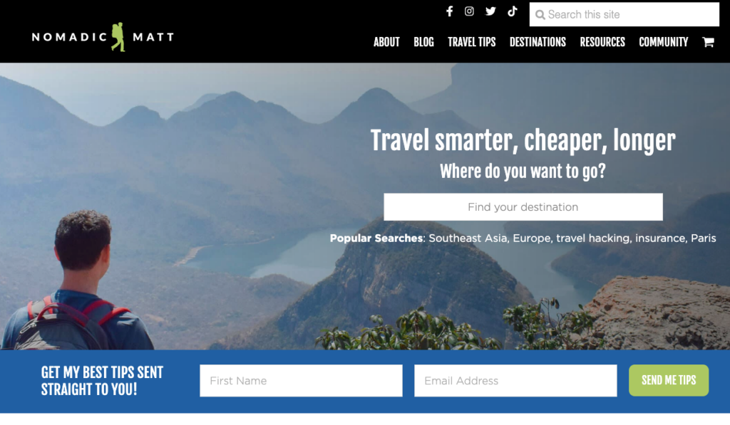 The image displays the homepage of travel blogger Nomadic Matt. The webpage headline says, travel smarter, cheaper, longer, while a man looks over a mountain range and lake. The webpage provides an example of storytelling in budget travel stories.
